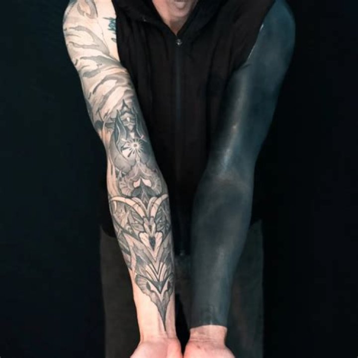 Uncover The Enigmatic Meaning Behind Blackout Arm Tattoos
